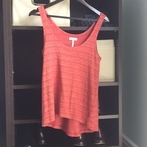 Flirty red top with gold detail!